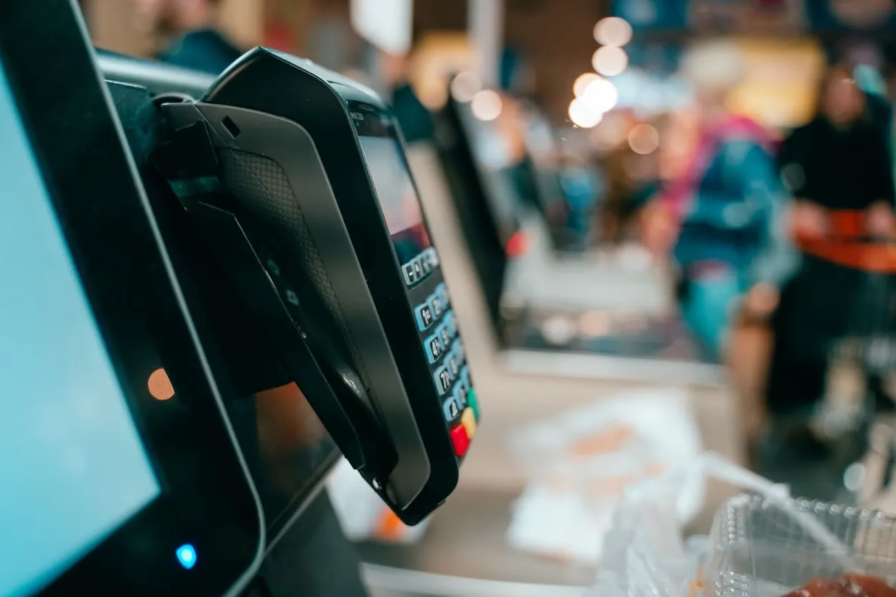 POS terminal mounted at a checkout counter - Freepik