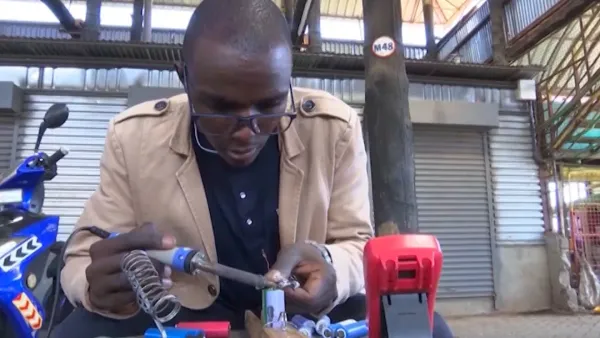 Kenyan Teacher Power Bikes with Old Laptop Batteries
